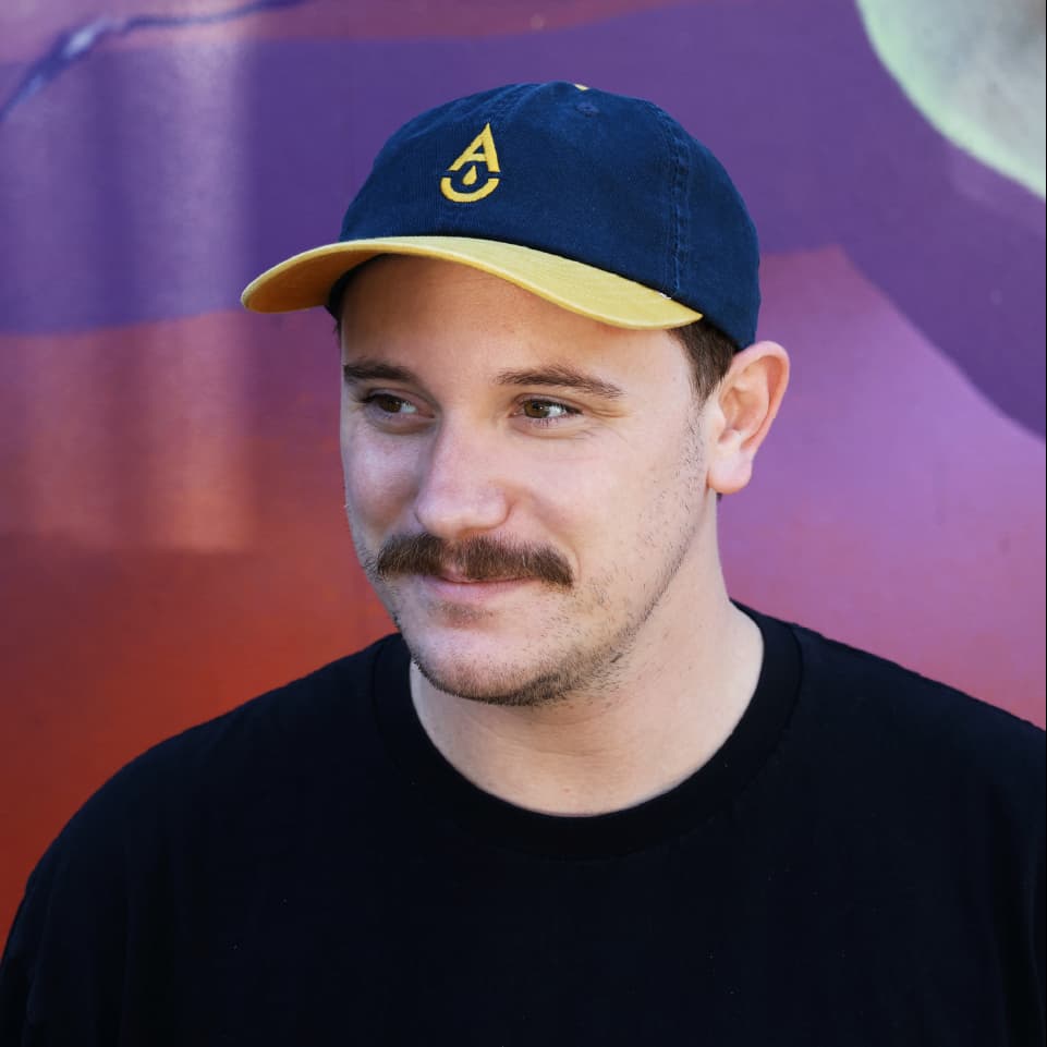 Brewery cap by Aether Brewing – yellow on navy, front view