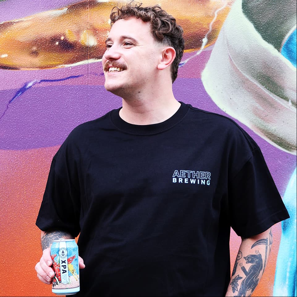 Brewery t-shirt by Aether Brewing – light blue on black, front view