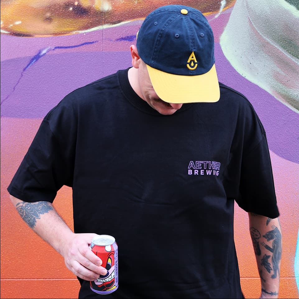 Brewery t-shirt by Aether Brewing – purple on black, front view