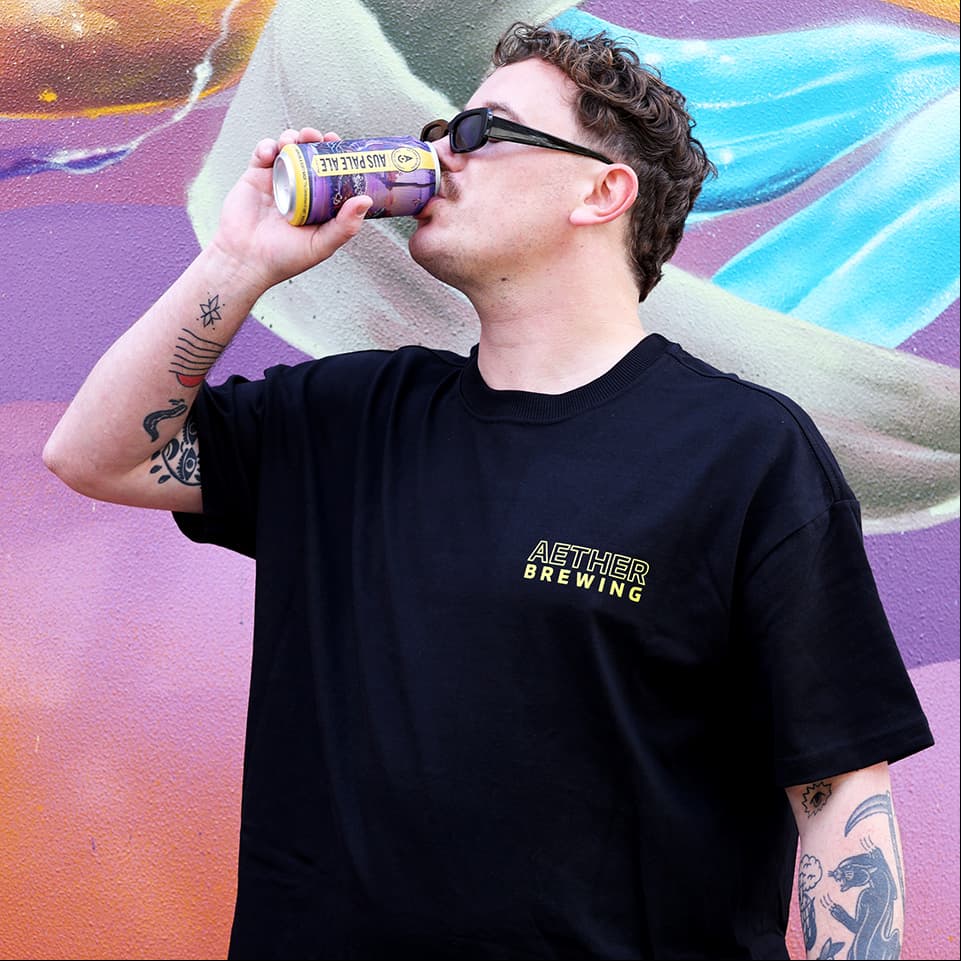 Brewery t-shirt by Aether Brewing – yellow on black, front view