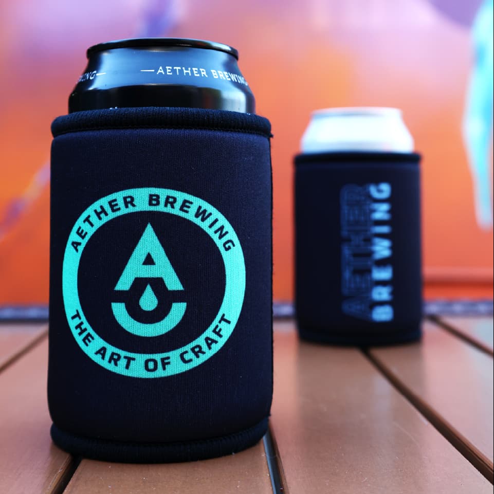 Aether Brewing stubby cooler – green on black design, front and back shown together