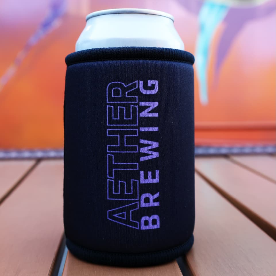 Aether Brewing stubby cooler – purple on black design, back view