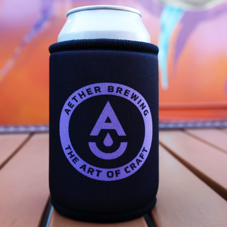 Aether Brewing stubby cooler – purple on black design, front view