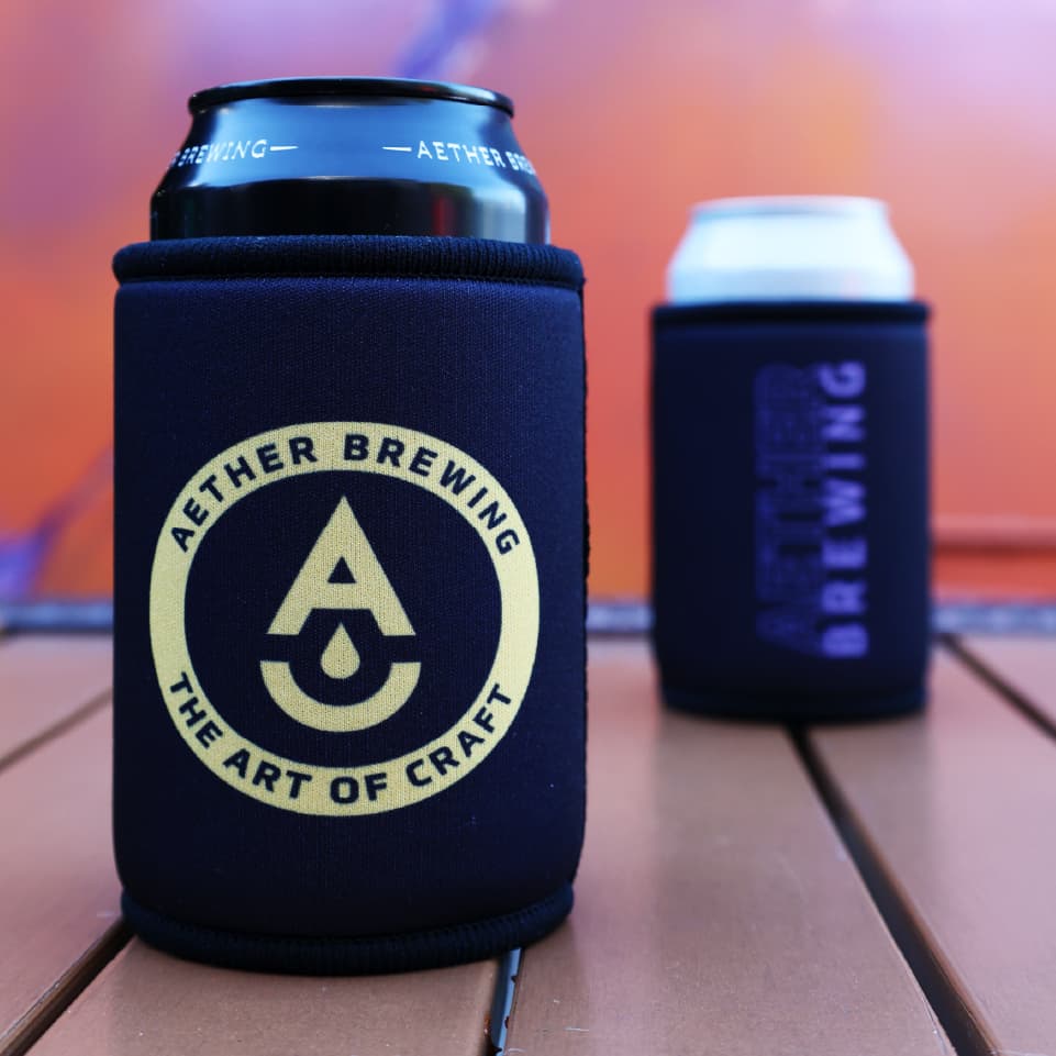 Aether Brewing stubby cooler – yellow on black design, front and back shown together